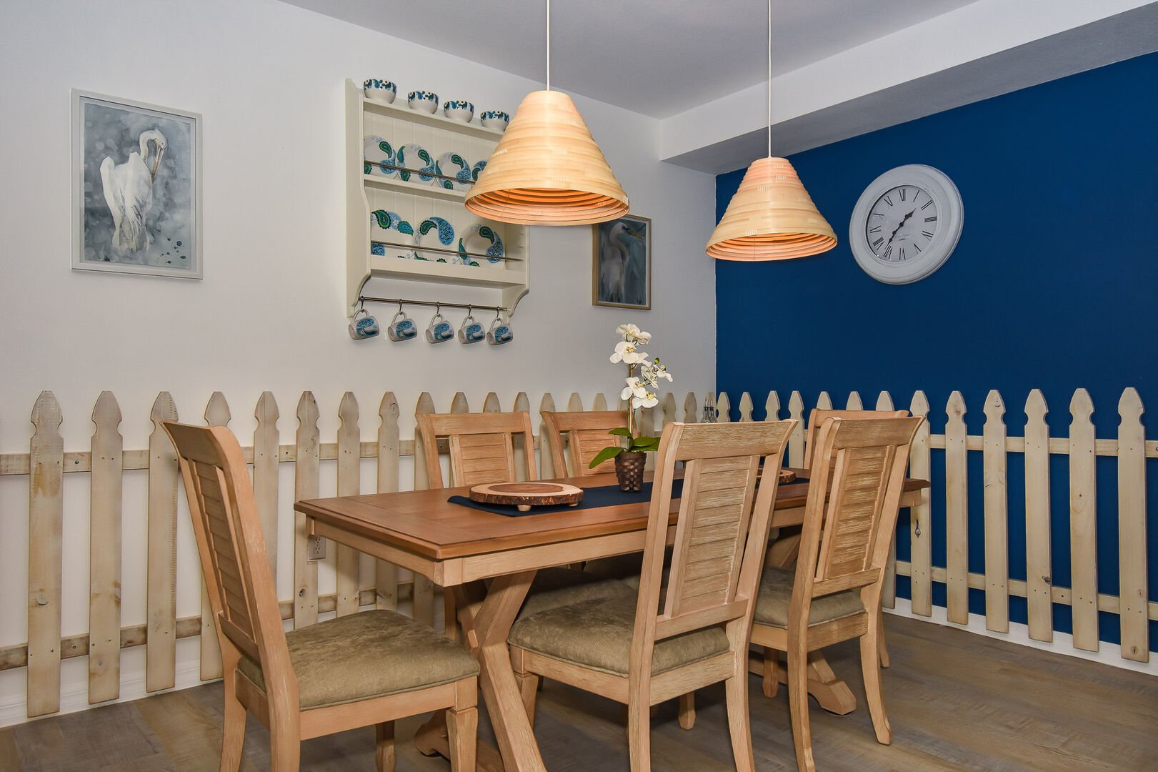 Dining table, chairs, and pendant lamps