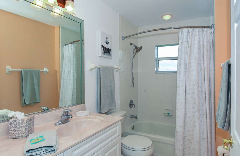 Shower-tub combo, vanity sink, and toilet
