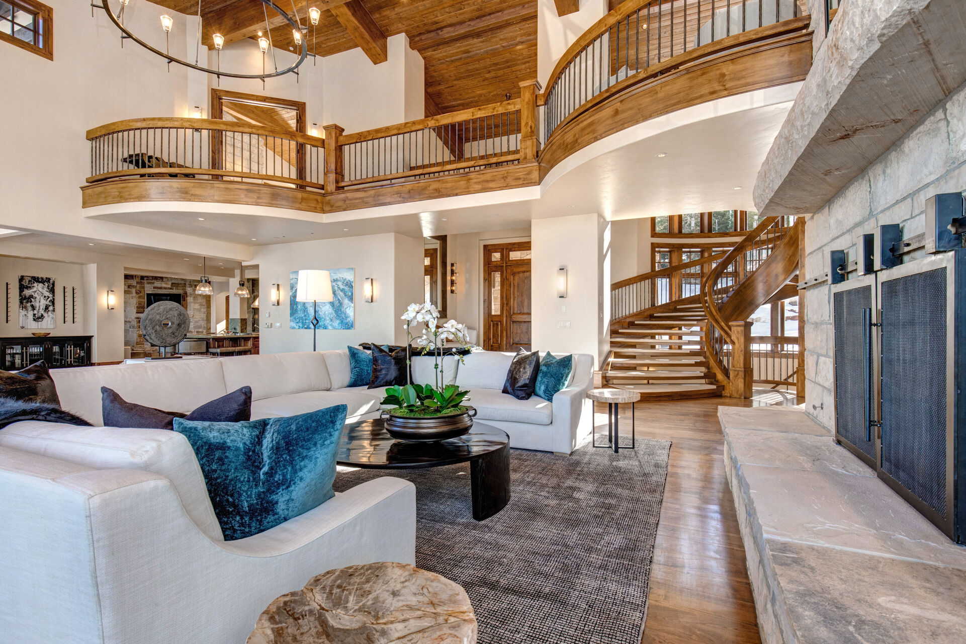 Enormous Upper Living Room with three separate sitting areas. This room provides ample seating, large wood-burning fireplace, and private, recently remodeled, sun-deck access