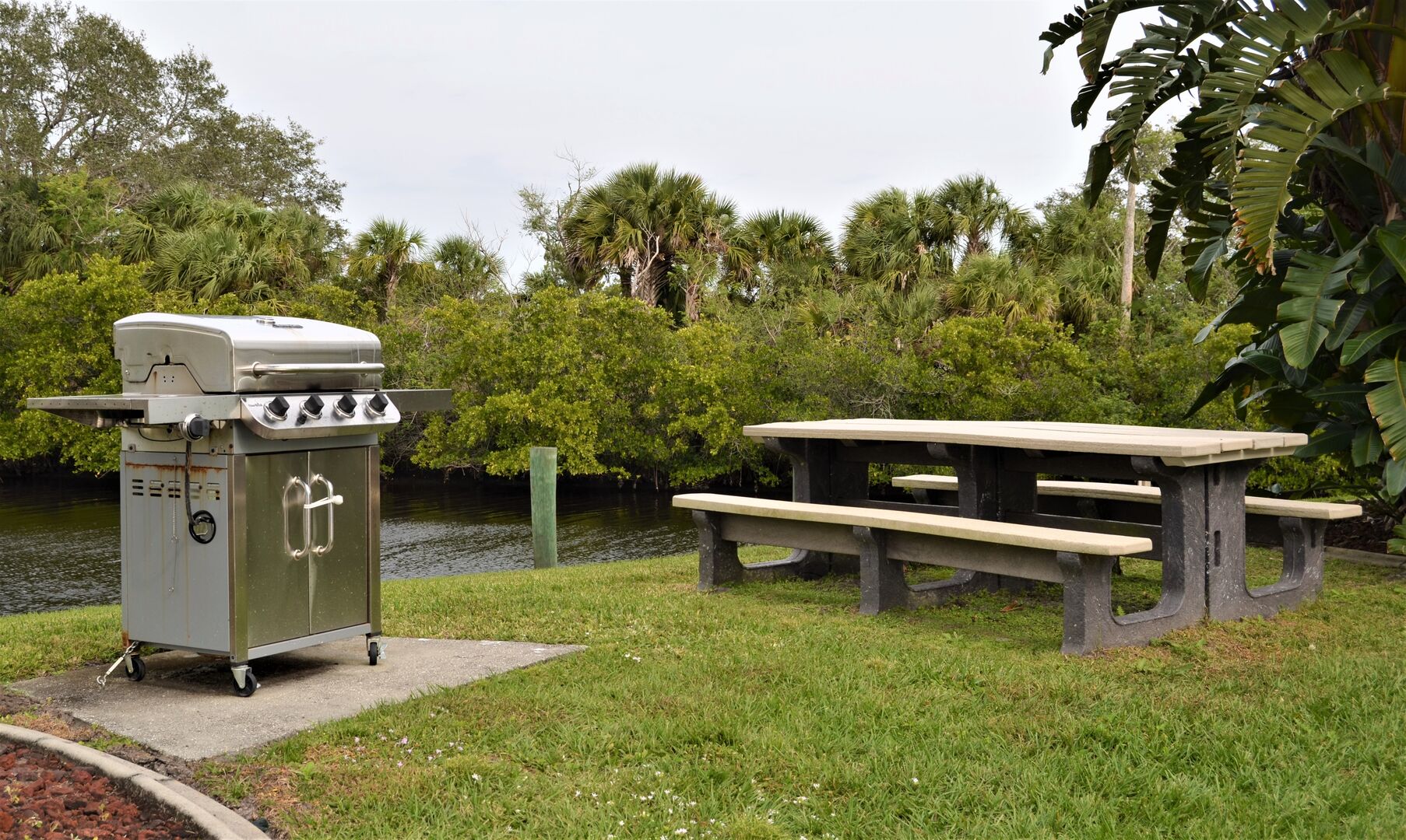 Multiple picnic areas along the resort canal for guest use.