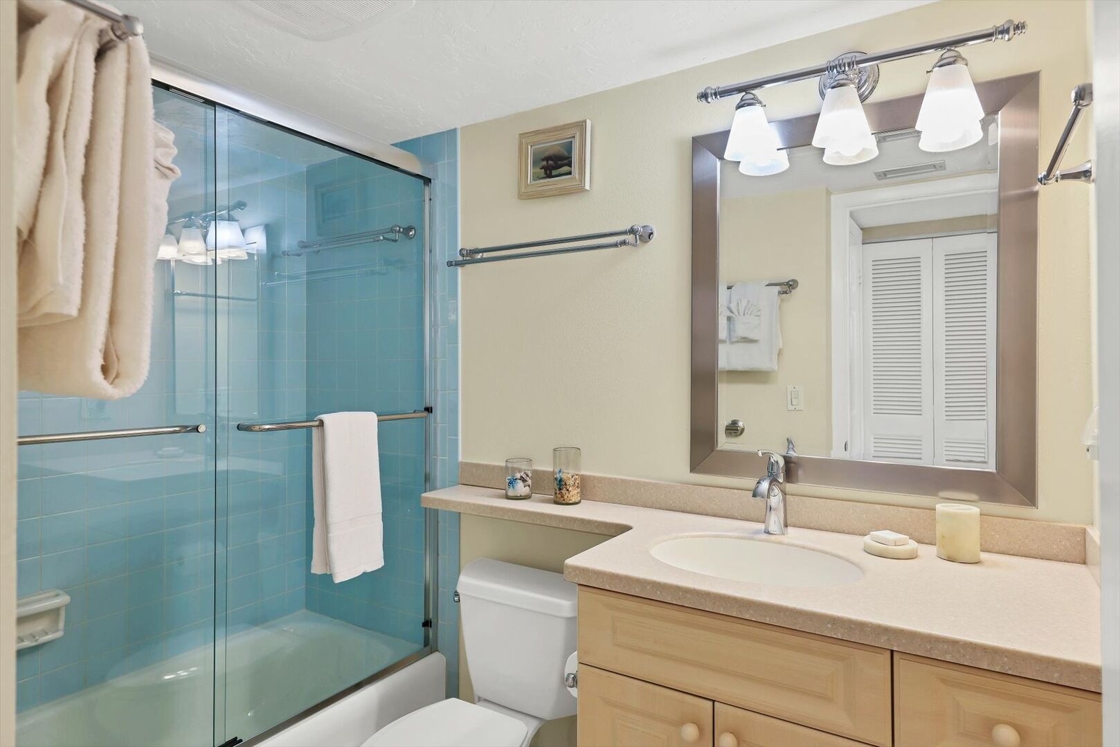 Guest bathroom featuring shower/tub combo