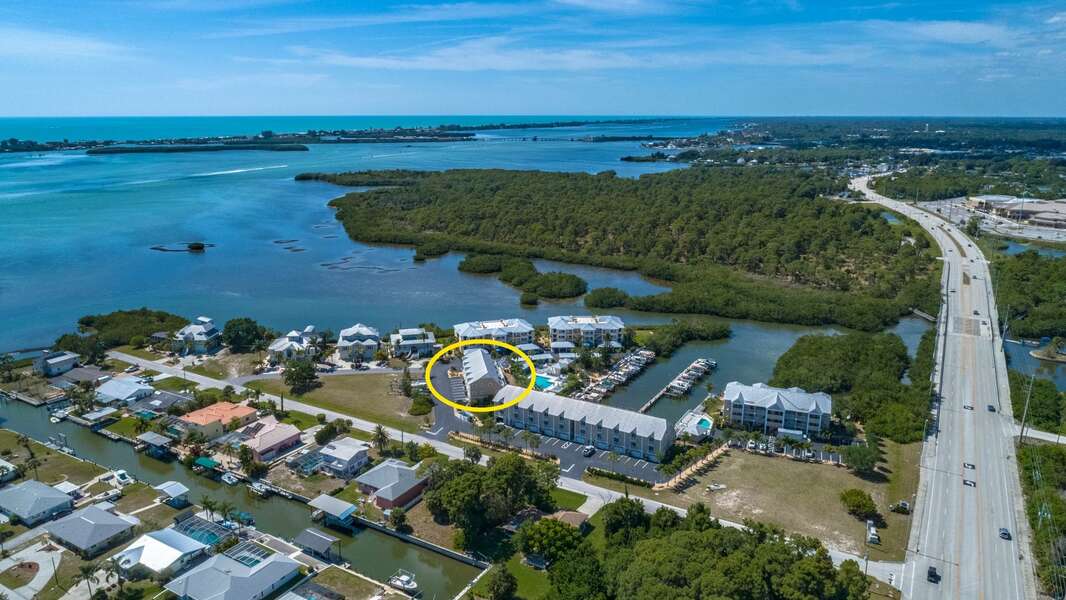 Aerial View overlooking the townhome in regard to the Gulf and Lemon Bay