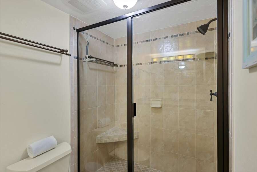 Primary bathroom with large vanity and walk-in shower