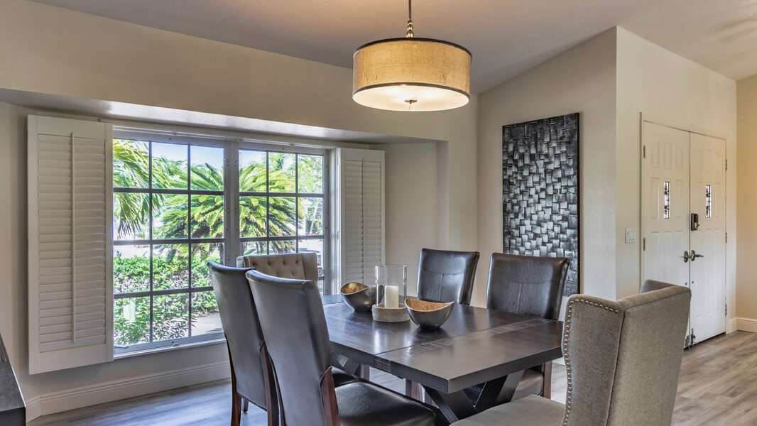 Dining Room overlooks the living room and the lanai just beyond
