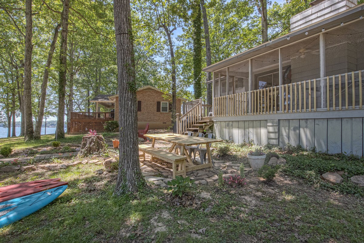 Outdoor seating and the exterior of this waterfront Smith Mountain Lake vacation rental.