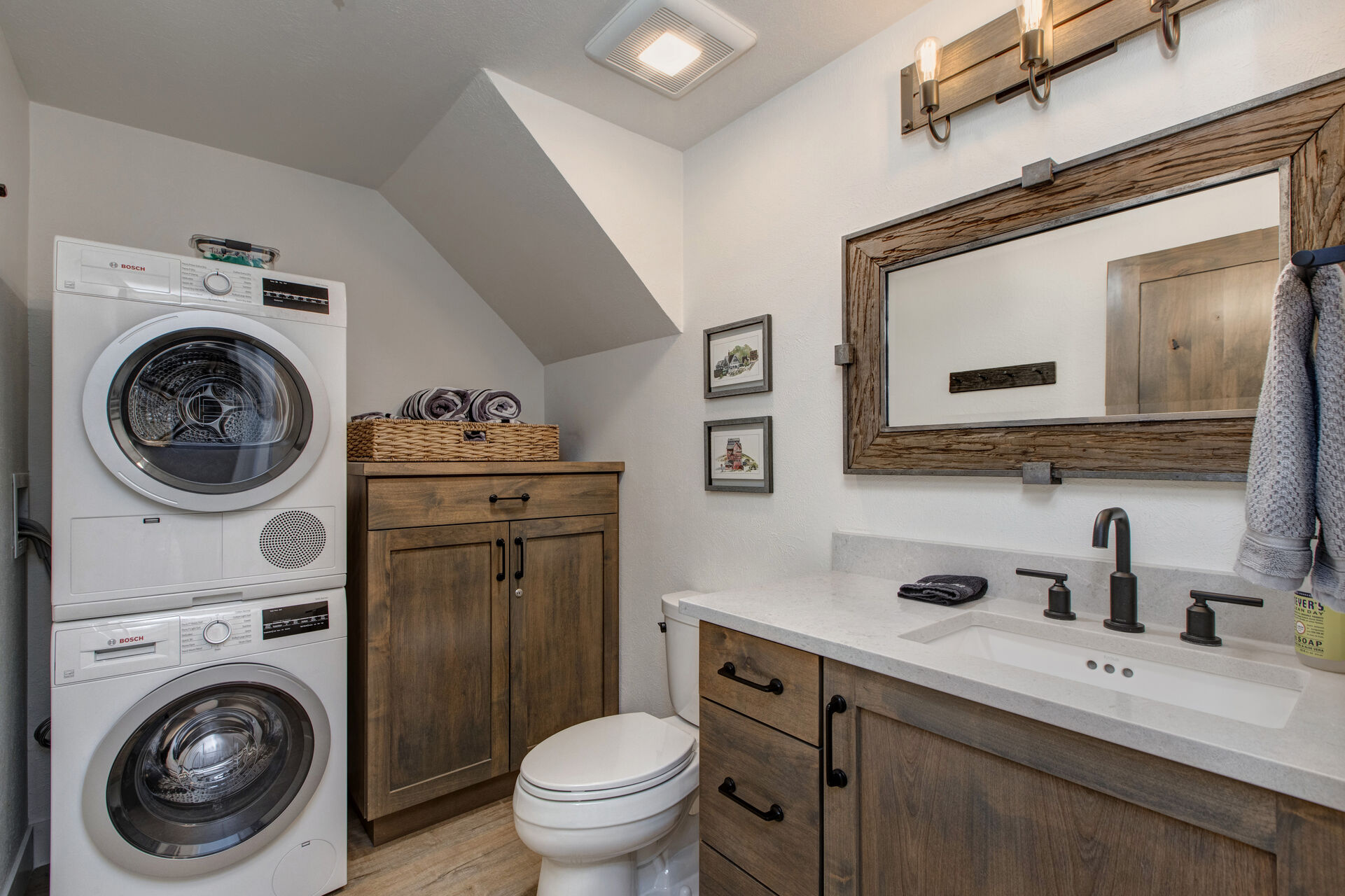 Main Level Half Bath with a Stacked Washer and Dryer