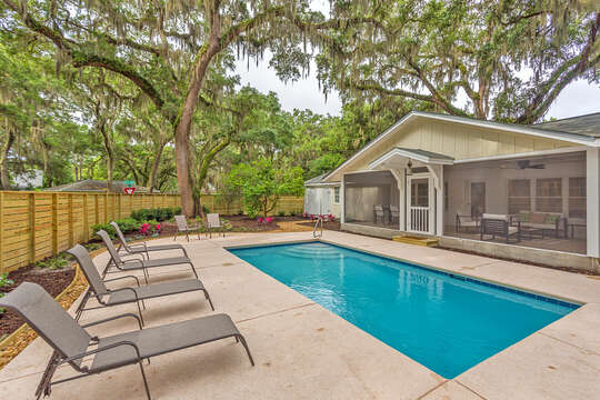 Sunshine Magnolia features a large backyard with plenty of space for sunning by the pool or relaxing in the shaded screened porch!
