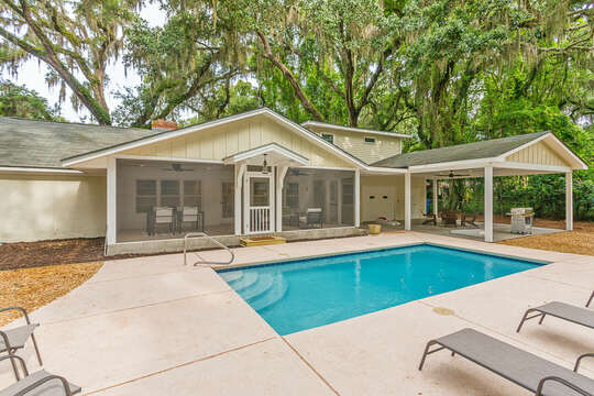 Enjoy the private pool and outdoor seating areas in the spacious backyard.