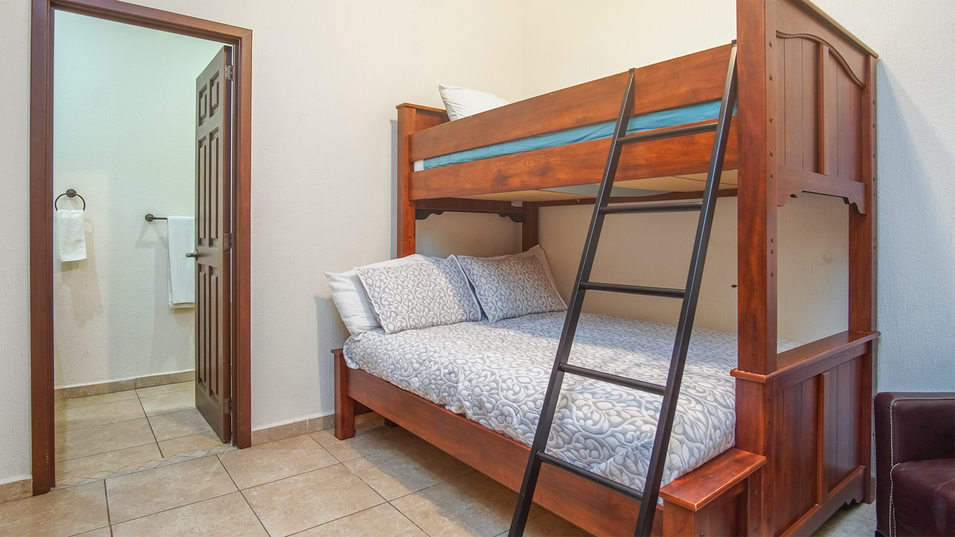 The fourth bedroom features oversized bunk beds, and its own attached bathroom.
