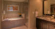 Bathtub, Shower with Glass Doors, in Our Steamboat Springs Vacation Condo.