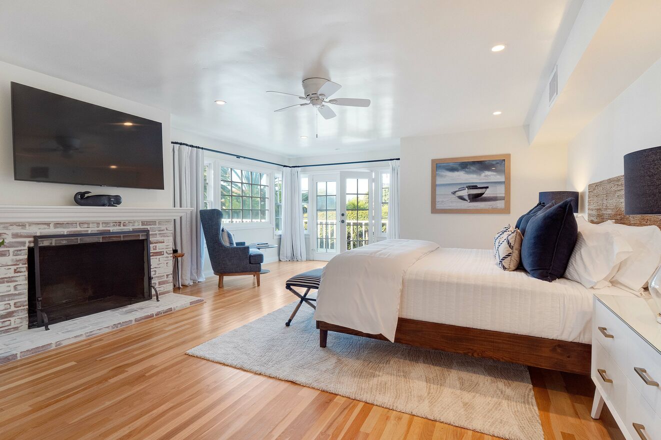 Downstairs Bedroom #6 with ensuite bathroom, ocean views, fireplace and private entrance.