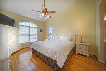 Master Bedroom Overlooking Lake on the Main Level, with large bed and twin nightstands.