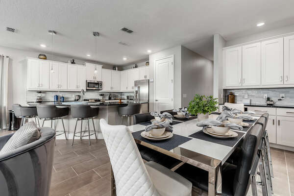 The open-concept floorplan provides smooth flow from the kitchen to the dining table