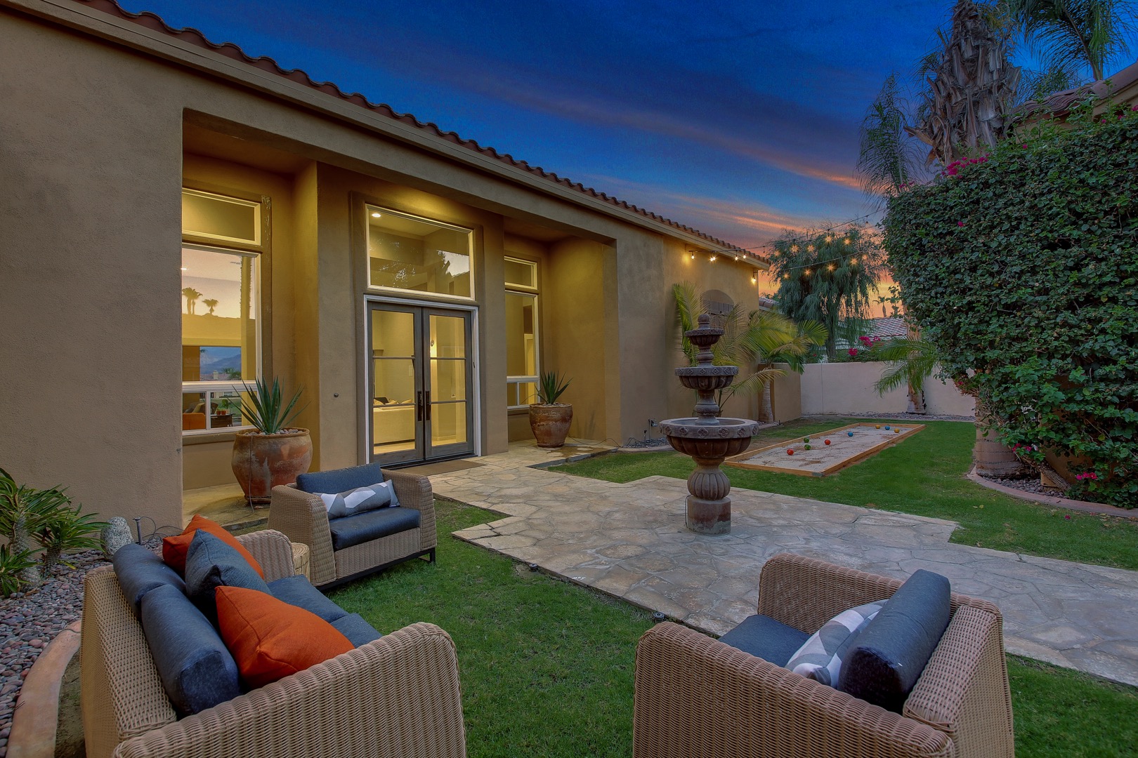 Need some space? Head out to the completely private courtyard which features a Bocce court and comfortable patio furniture.