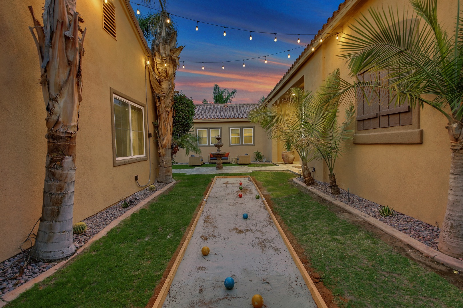 Play a little Bocce under the string lights.