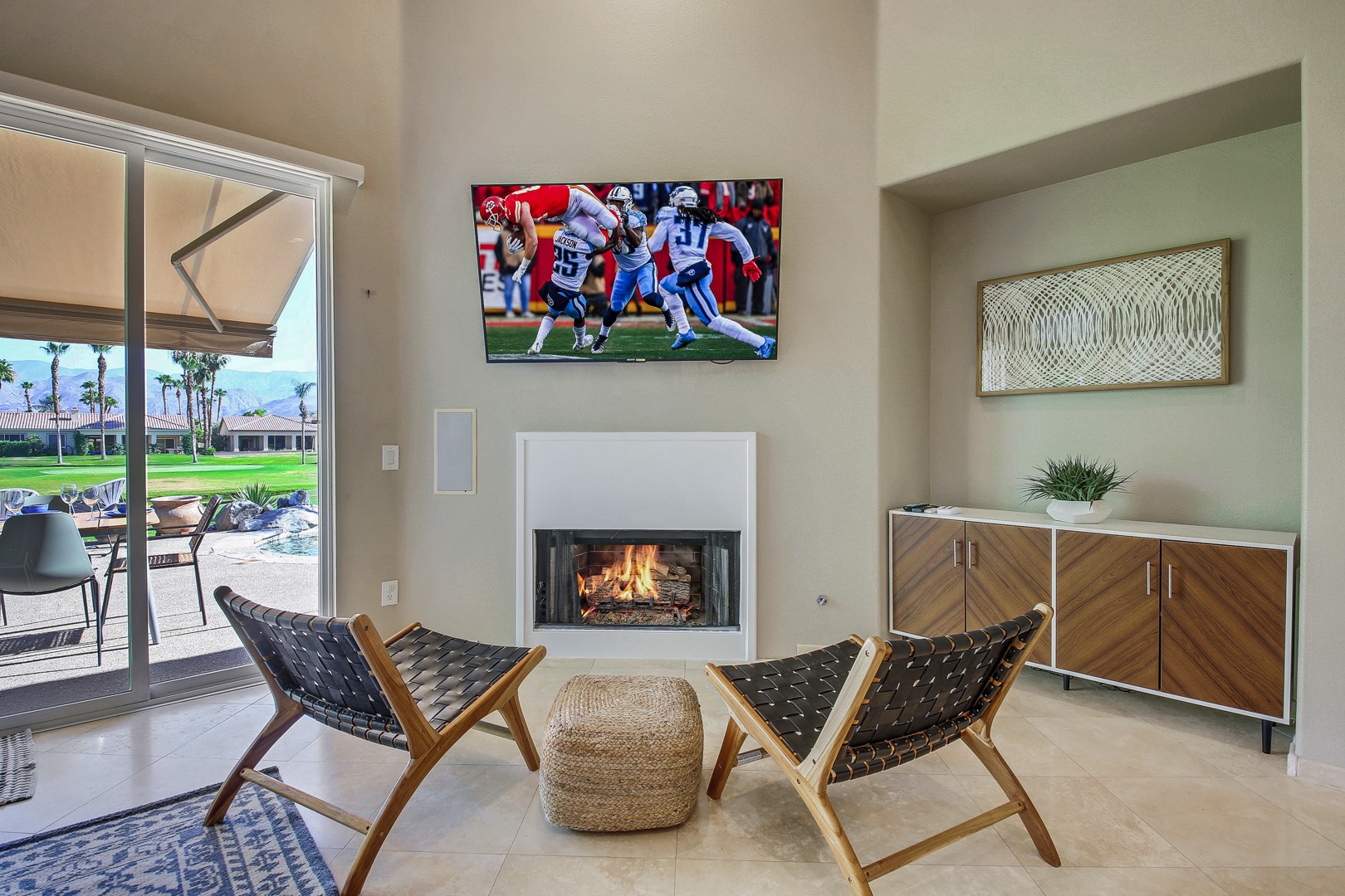 Finished with your meal and still want to hang out? Move over to to the lounge area which features two chairs, a fireplace and a 65-inch Samsung HDTV.