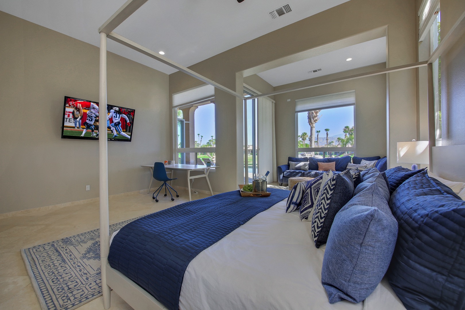 Enjoy the view of the famous Laquinta mountains from bed or the view of the 60-inch high def TV.