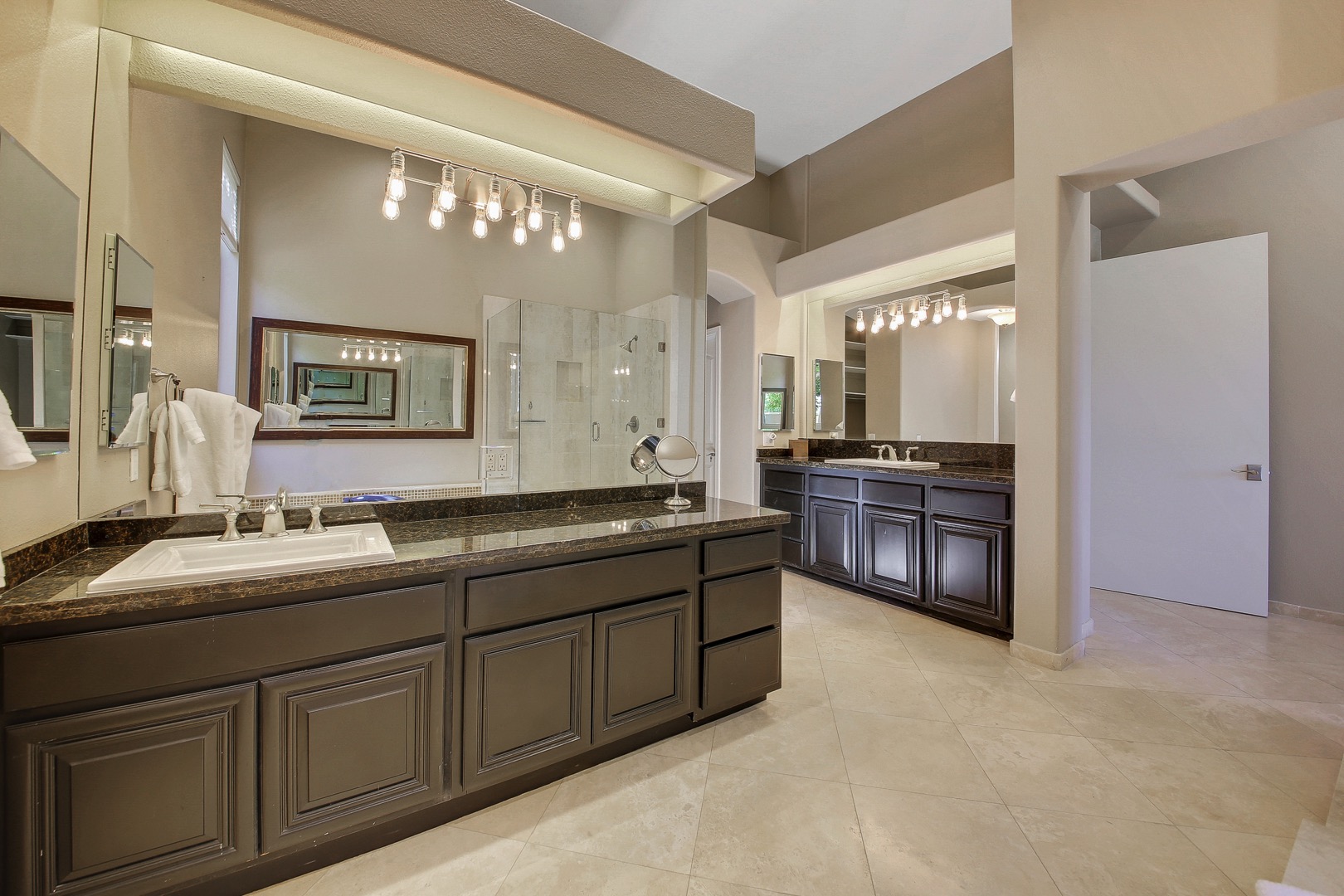 The master bathroom is enormous with his & hers separate sinks