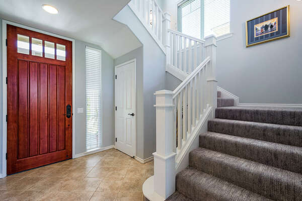 Large Wooden Front Door and Staircase to the 2nd Level