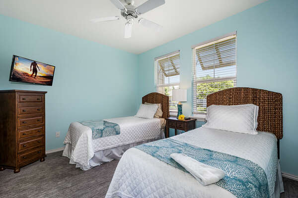 Bedroom 2 with 2 Beds and a TV at Fairway Villas Waikoloa G1