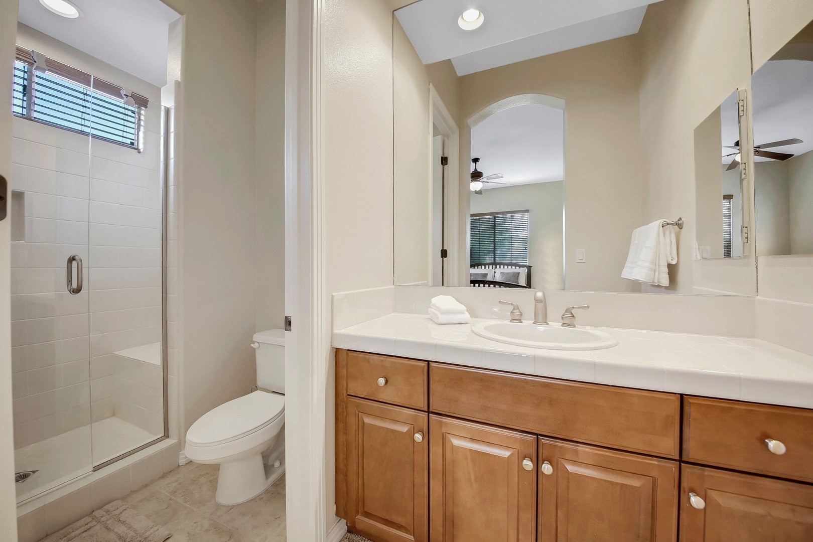 Suite 2 features a private, en suite bathroom with a tile shower and sink.
