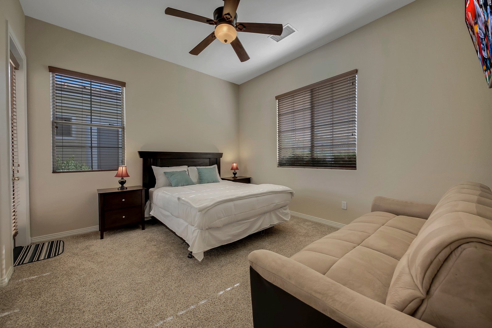 Bedroom 4 is located across from Suite 2 and features a  Queen-sized Bed, Twin-sized Sofa Sleeper and 42-inch TCL by Roku Smart television.