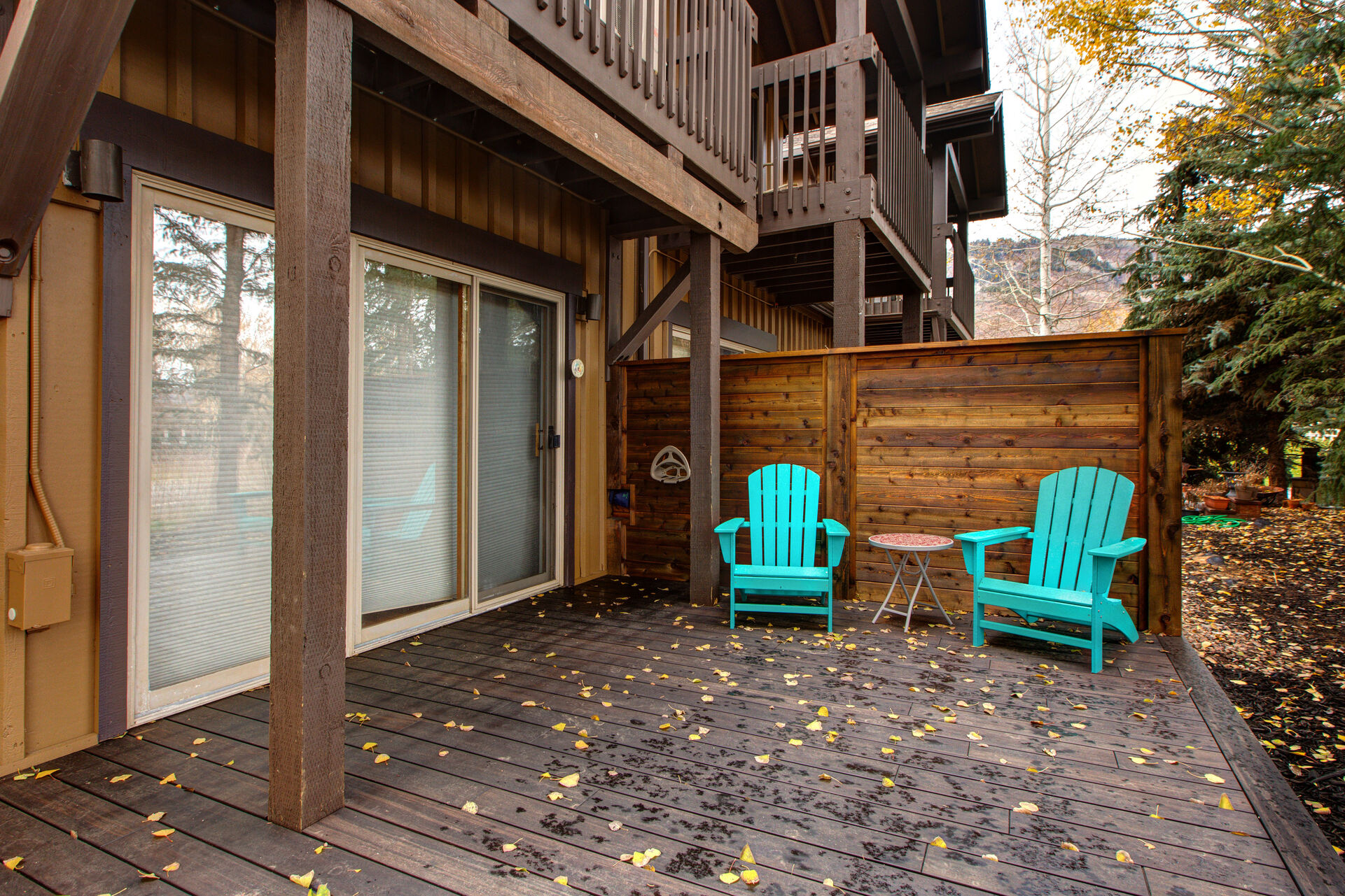 Private deck with Adirondack chairs and bistro table