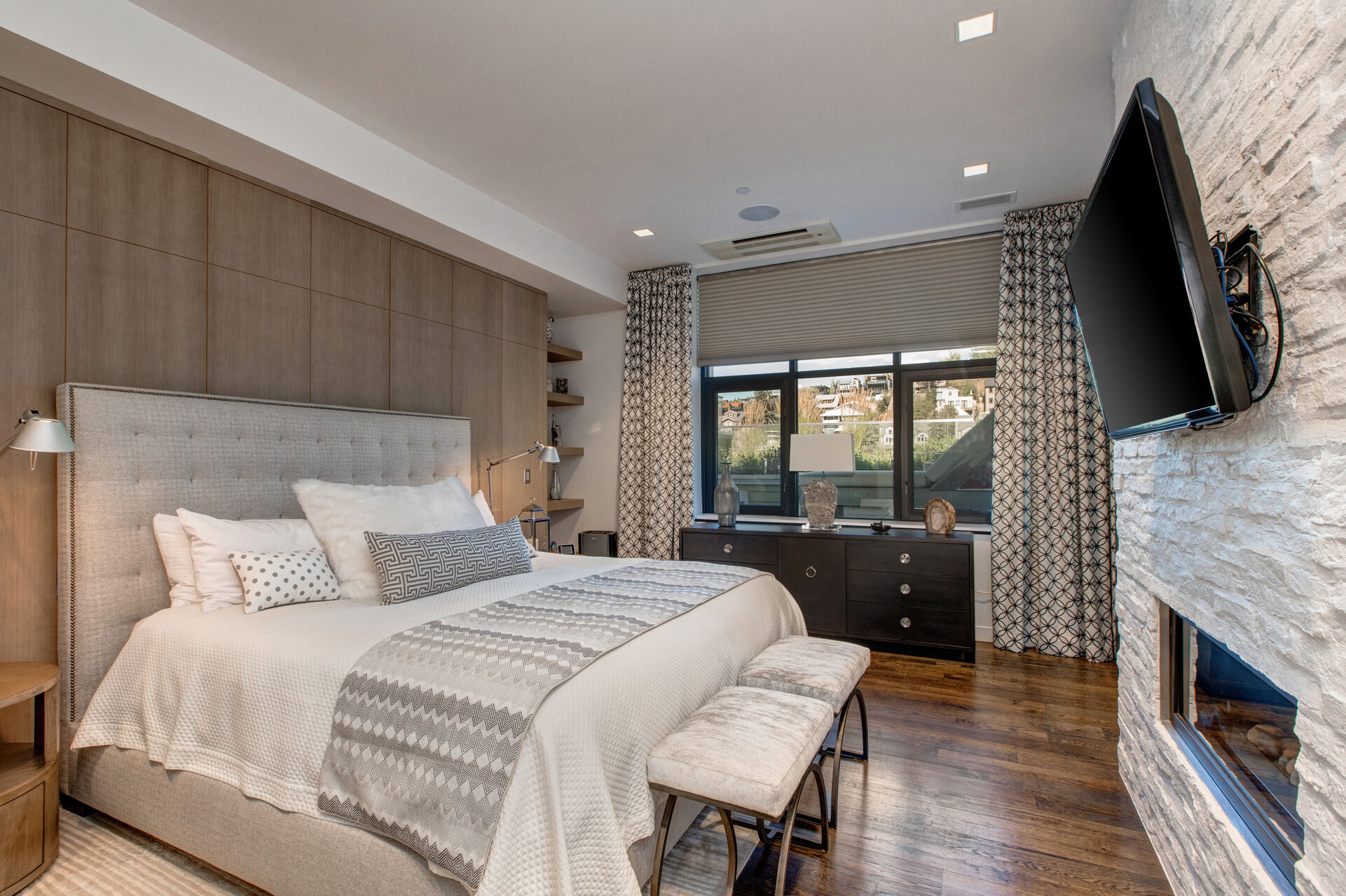 Grand Master Bedroom with a King Bed, Gas Fireplace and 55