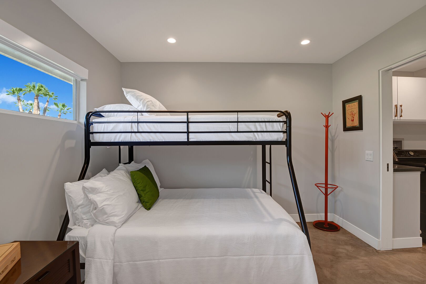 Full size and twin size bunk room that connects to the master bathroom and laundry room.  It's situated in between these two rooms.  Two entrances to the bunk room, through living room or master bath.  Separated with pocket doors for privacy.  Has its own smart tv mounted on the wall.