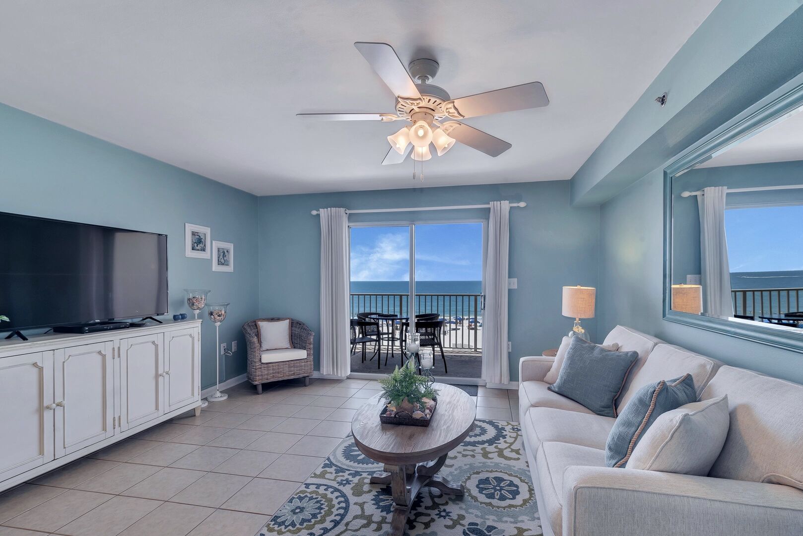 Spacious Living Room with views of the Beautiful Gulf of Mexico and access to Private Balcony and Full Size Sleeper Sofa