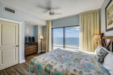 King bed + stunning floor length windows for view of the Gulf