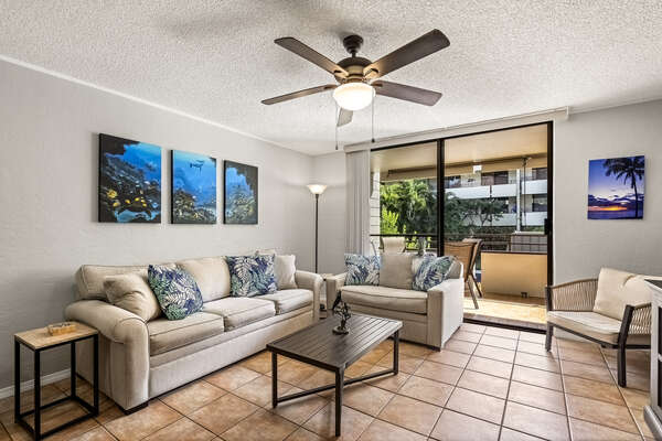 Sofa, Armchair, Ceiling Fan, and Sliding Doors to the Covered Lanai