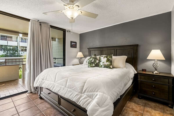 Bedroom with Lanai Access, Large Bed, Nightstands, and Ceiling Fan