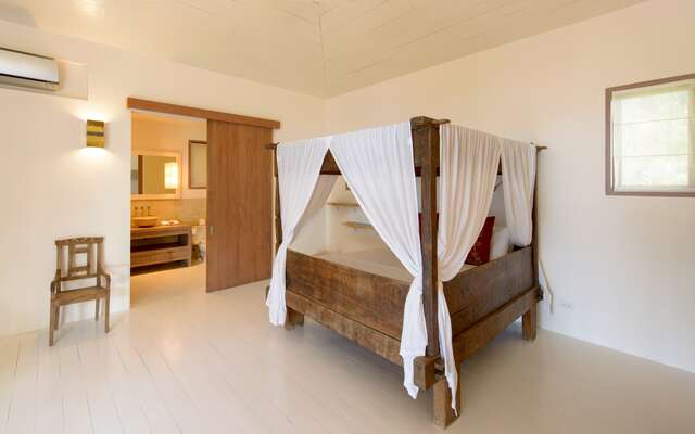 Located at upper pool / main level with ocean / garden view
Antique Javanese bed