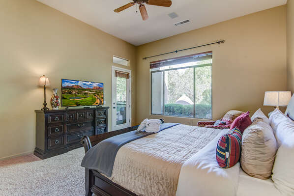 Master Bedroom with a Smart TV and Patio Access