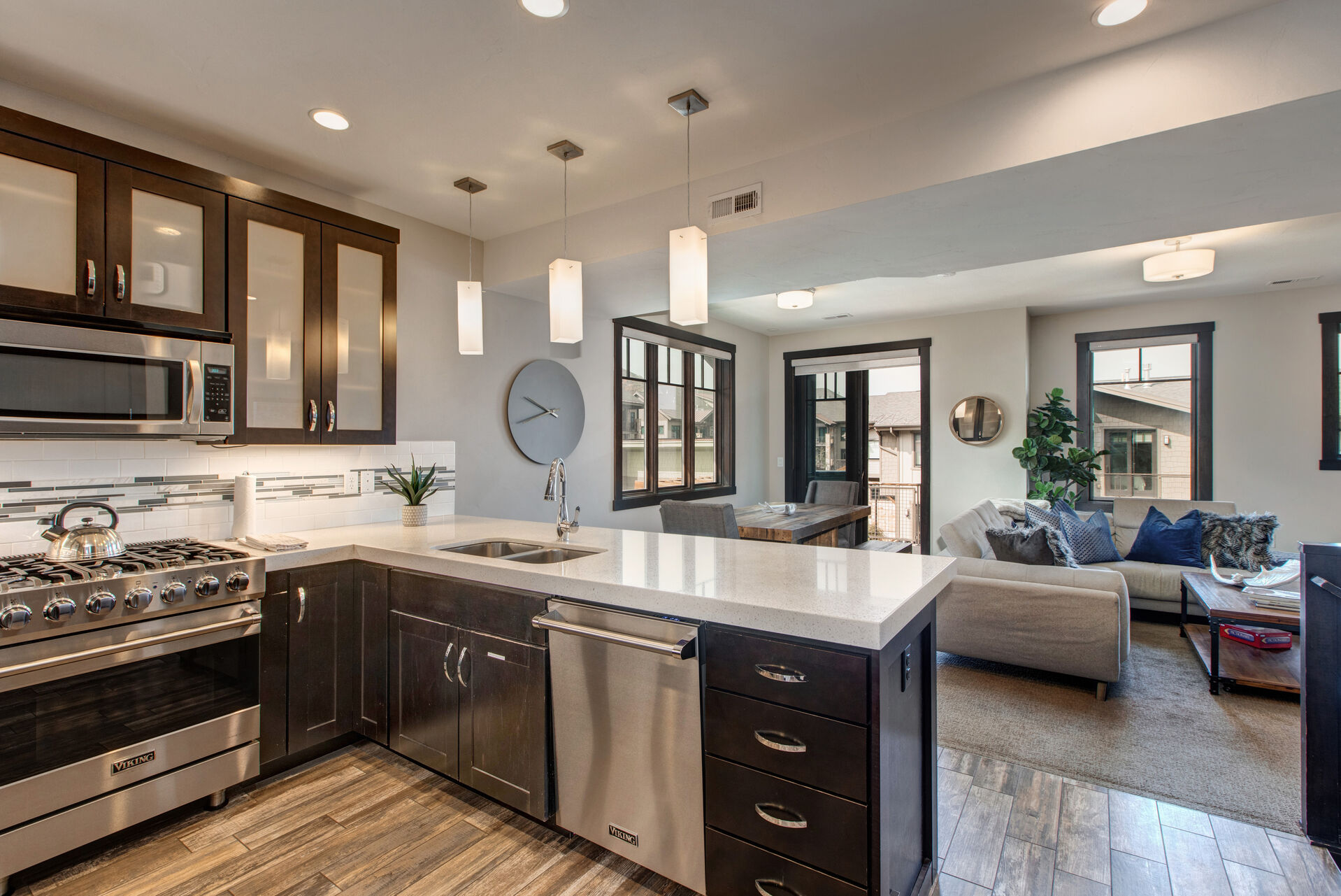 Fully Equipped Gourmet Kitchen with Stone Counters and High-end Stainless Steel Appliances