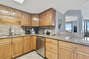 Fully Equipped Kitchen with Stainless Steel Appliances with Extra Seating at the Breakfast Bar