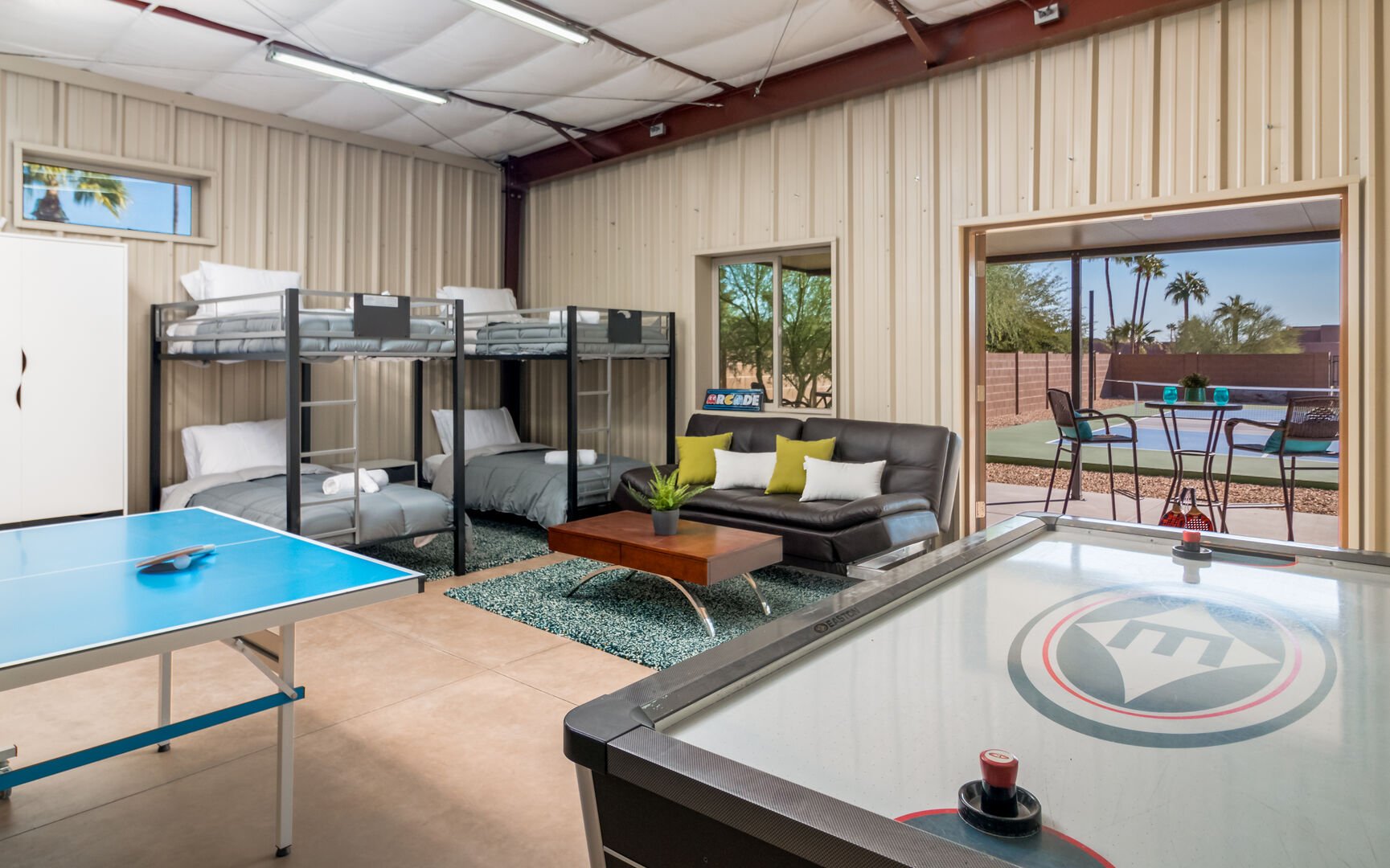 Game Room w/ Air Hockey and Ping Pong, & Pickleball Court in Background