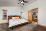 Upper Level Master Bedroom with king bed, gorgeous modern decor, private balcony, and en suite bathroom