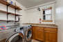Upper Level Laundry Room with counter-space snd full-sized washer/dryer