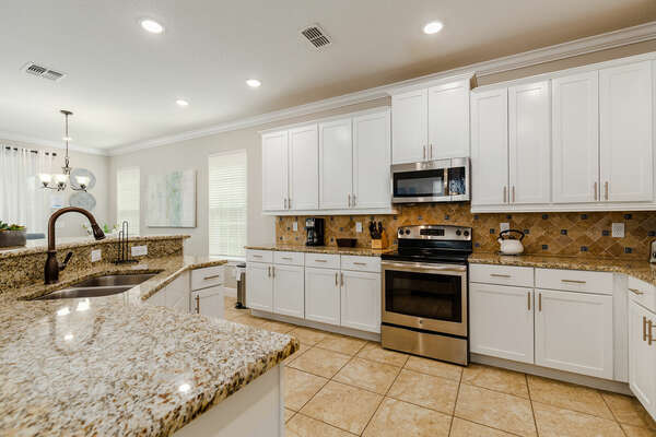 The kitchen features stainless steel appliances.