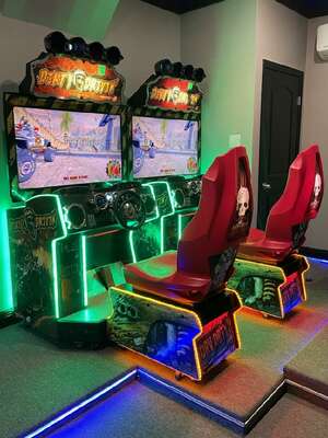 Challenge a family member to a race on the racing arcade machine
