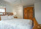 There is a queen bed in this room and a private bathroom.