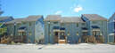 Just a couple of steps up from the parking area onto a walkway to the entrance of the townhome