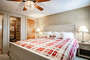 Master bedroom featuring a king-size bed.