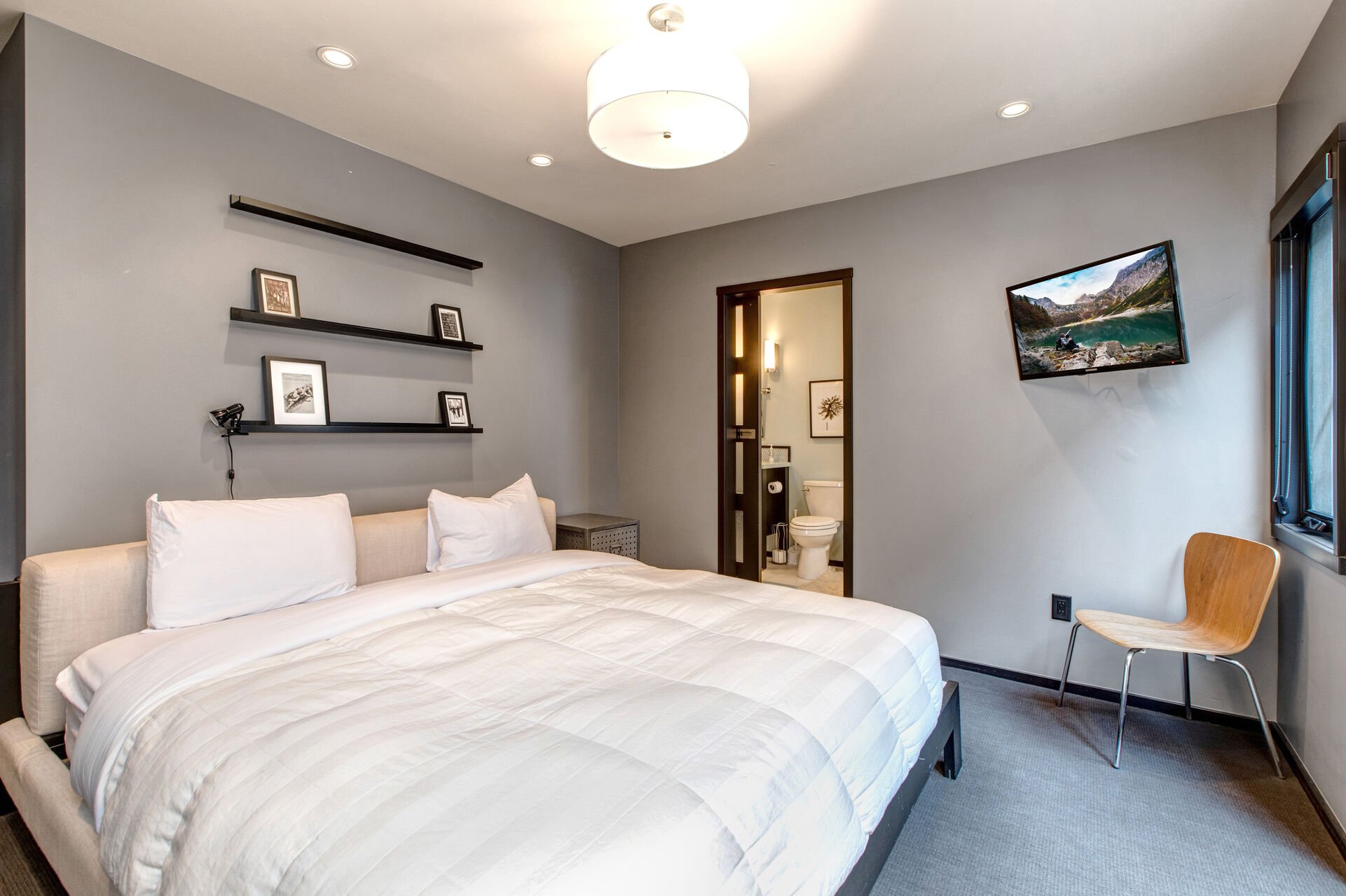 Master Bedroom with king bed, private patio, smart tv, and en suite bathroom