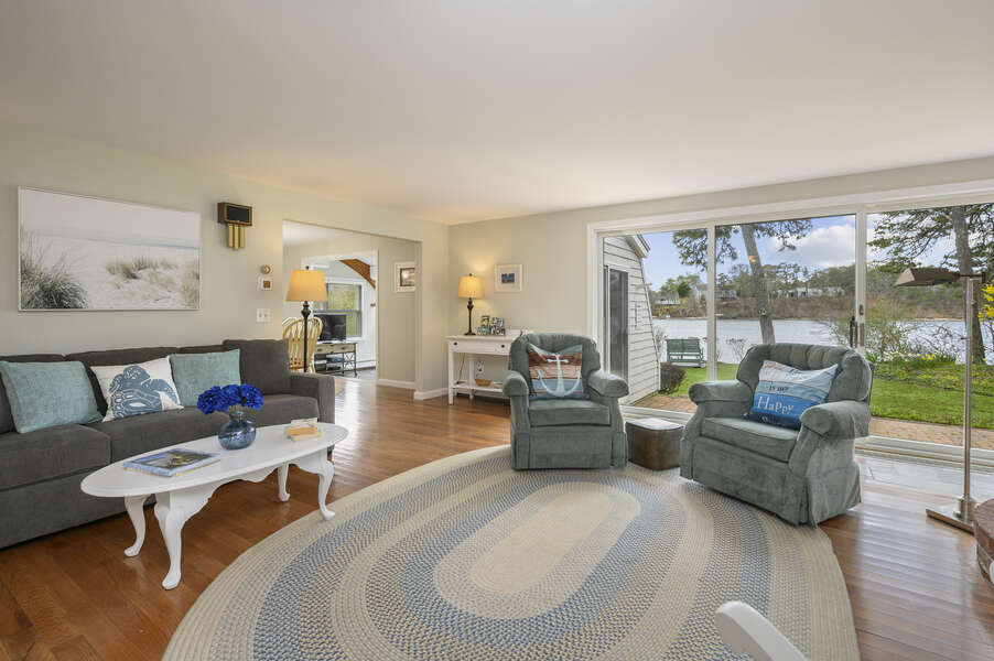 Comfy, family style living room with access to back patio and views of the pond - 35 Vacation Lane Harwich Cape Cod - New England Vacation Rentals