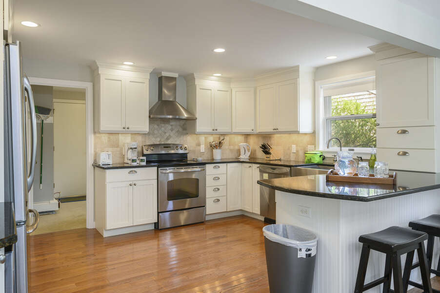 Open kitchen with breakfast bar and 3 stools for additional seating - 35 Vacation Lane Harwich Cape Cod - New England Vacation Rentals
