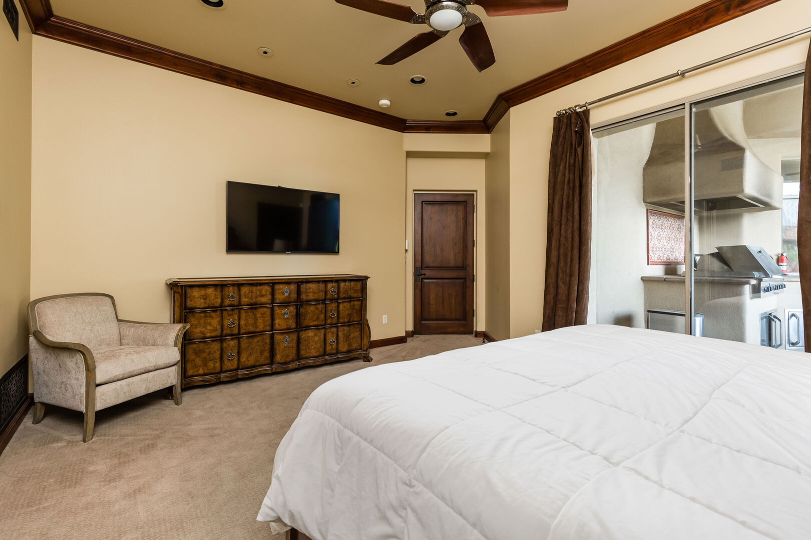 3rd Bedroom featuring a King Bed, bedroom furnishings, and a Smart TV with an ensuite Bathroom.