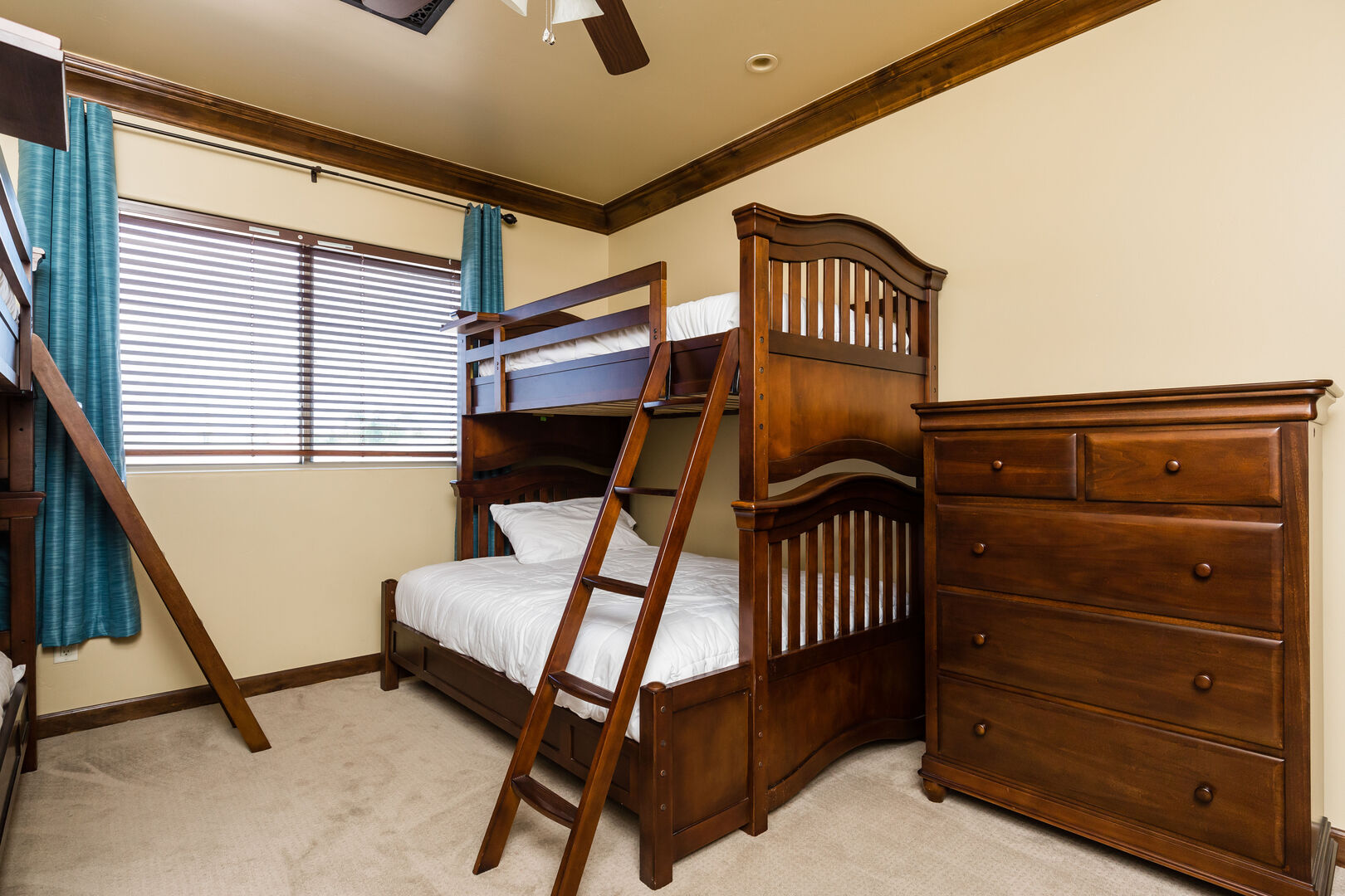 4th Bedroom featuring 2 Bunk Beds offering 3 Twin Beds and a Queen Bed with bedroom furnishings and an ensuite bathroom.